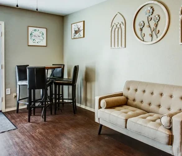Dining nook and sitting area with hardwood floors